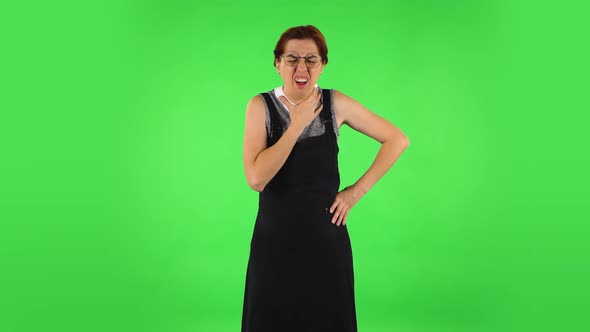 Funny Girl in Round Glasses Is Getting a Cold, Sore Throat and Head, Cough. Green Screen