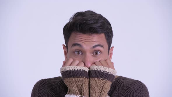 Face of Young Hispanic Man Feeling Cold for Winter