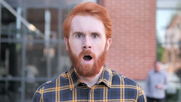 Outdoor Wondering Redhead Man in Shock