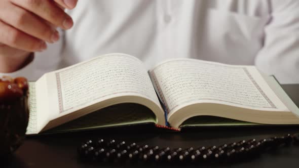 Muslim Man Praying with Rosary Reading Koran Closeup Islamic Religion