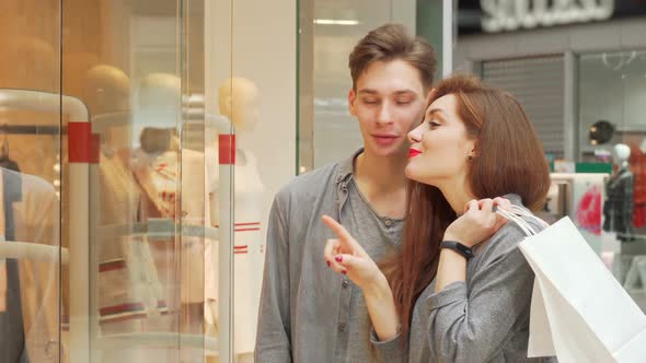 Lovely Woman Enjoying Shopping at the Mall with Her Boyfriend