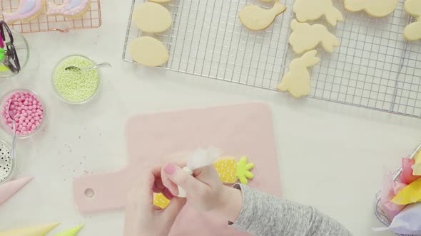 Step by step. Flat lay. Decorating Easter sugar cookies with royal icing