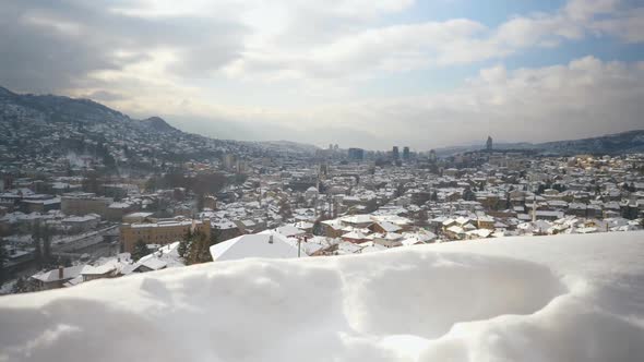 Overview of a snow-filled rooftops of a neighborhood in Sarajevo