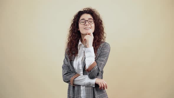 The Arrogant Young Businesswoman with Her Finger Emits a Gun to Shoot Competitors in the Market