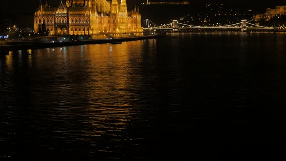 Budapest National Parliament building and river Danube by the night 4K 2160p UltraHD tilting footage