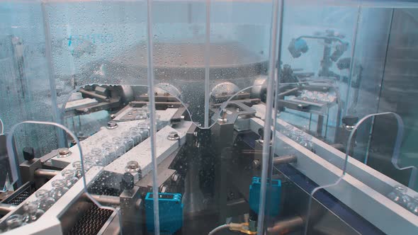 Medical Bottles Are Washed and Disinfected in the Production Line