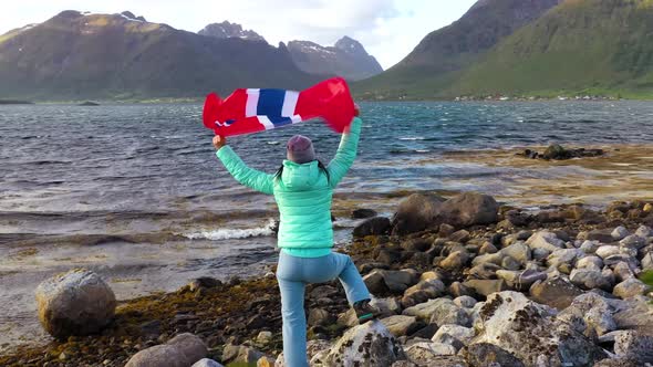 Woman with a Waving Flag of Norway
