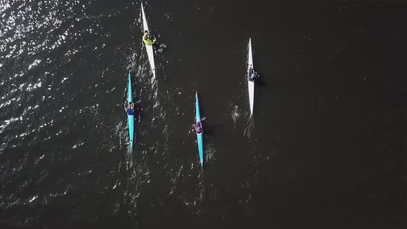 Four Professional Kayakers on Training. Athletes in Kayak Paddling on the River, Top View