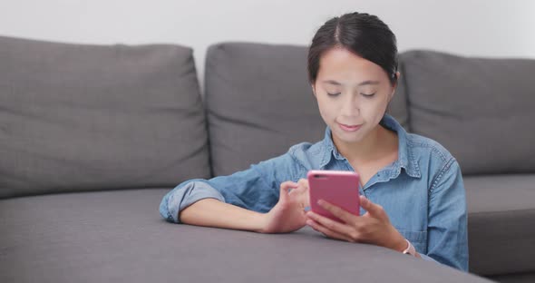 Woman watching on cellphone