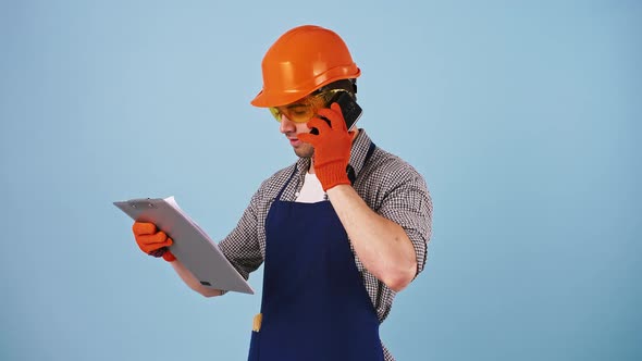 Young Man in Safety Clothes Hard Hat Protective Goggles Gloves