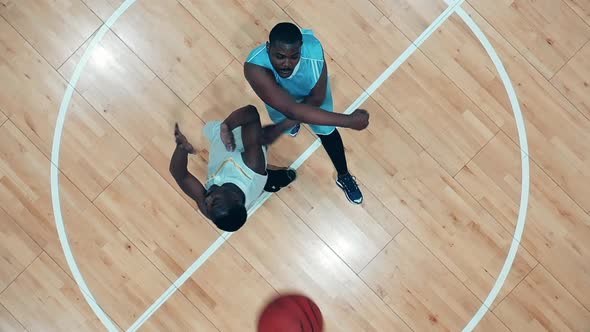 Top View of Two African American Players Fighting for a Basketball