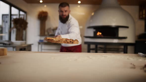 Italian Chef Making Pizza in Restaurant