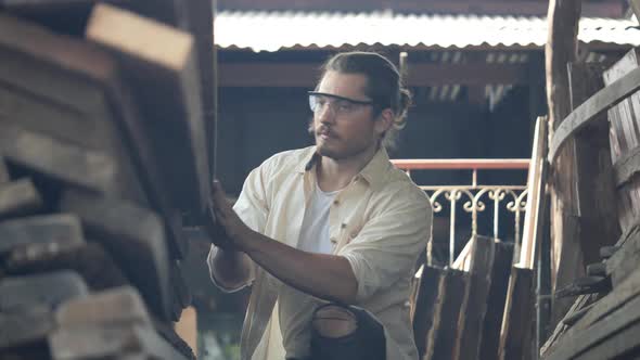 Carpenter checking wood