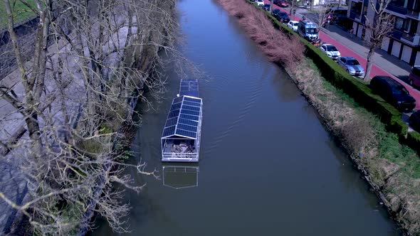 Boat Powered by Solar Panels Sailing on the Channel of Ghent Belgium Aerial Shot