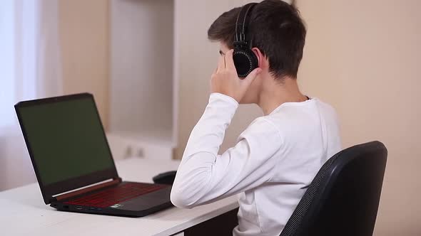 Teenage Boy Finish Game and Put His Hand Behind His Head