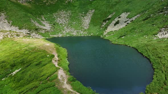 Arial View of the highest lake of Carpathian Mountains - Brebenescul