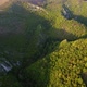 Aerial view of karst landscape, with valleys and cliffs, at sunset - VideoHive Item for Sale