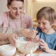Happy Laughing Little Boy Mixing Dough Ingredients in Big Bowl - VideoHive Item for Sale