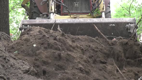 Heavy Machinery of the Construction Site is Moving Dirt Excavator