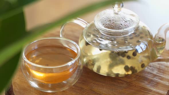 Green Tea Is Brewed in a Glass Teapot.