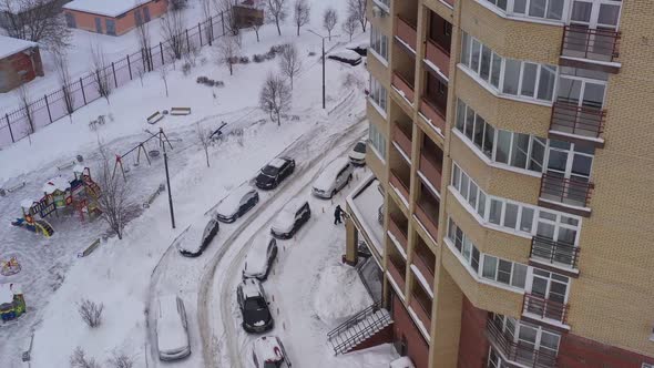 Modern Brick House and Snowcovered Yard After Snowfall