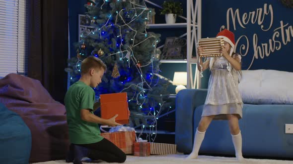 Kids Running and Opening Christmas Presents