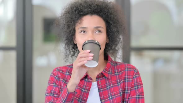 Portrait of African Woman Drinking Coffee