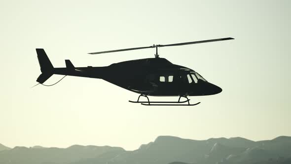 Extreme Slow Motion Flying Helicopter and Sunset Sky