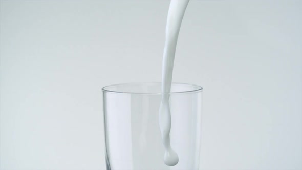 Pouring milk into glass, Slow Motion