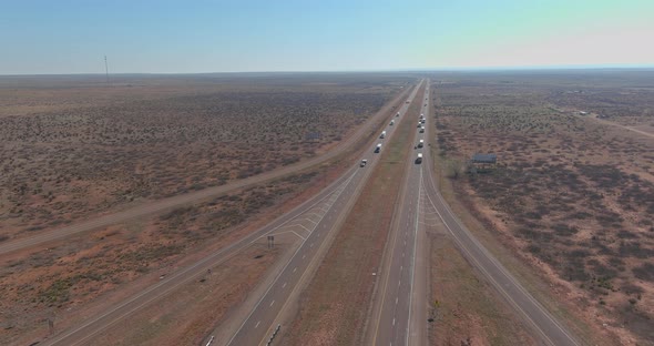 Desert Road Aerial of a New Two of Long Lane Road Through Surrounded By Desert Landscape Near San