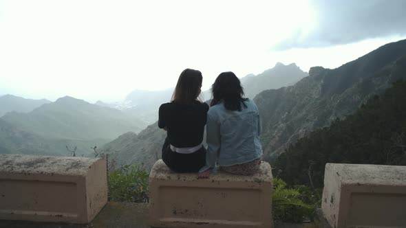 Two Beautiful Women Friends Looking at Beautiful Mountain View of Tenerife Island