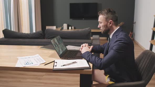 Business Man Having Video Meeting With Partners