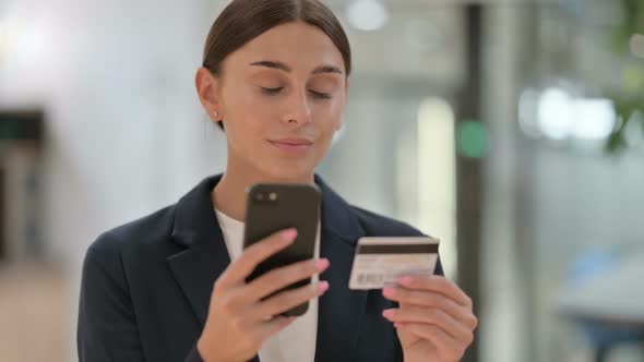 Portrait of Online Payment on Smartphone By Businesswoman