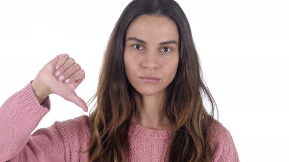 Thumbs Down by Young Latin Girl, White Background