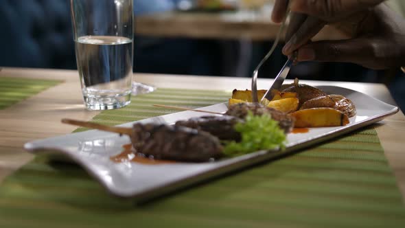 Closeup Plate with Meat Kebab and Baked Potato