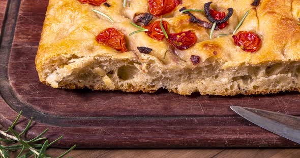 Traditional Italian Focaccia with pepperoni, cherry tomatoes, black olives, rosemary ando onion - ho