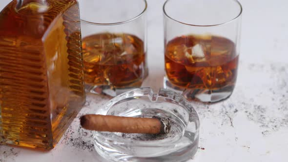 Bottle and Glasses of Brandy or Wiskey and Nice Big Cuban Cigar