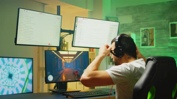 Young Man Playing Games on Powerful PC