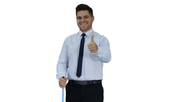 Man with thumb up holding broom in formal clothes or business