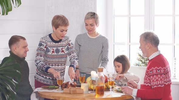 Cheerful Family Eating Christmas Meal