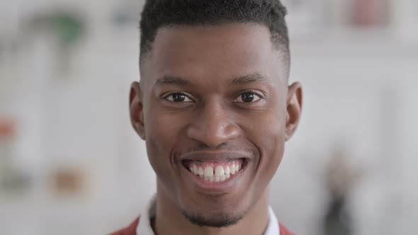 Close up of Face of African Man Smiling at the Camera