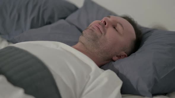 Close Up Casual Man Sleeping in Bed Peacefully