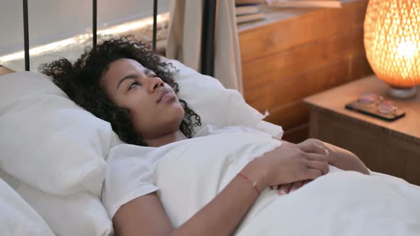 Peaceful Young African Woman Sleeping in Bed 