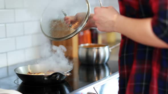 Man preparing food in kitchen at home 4k