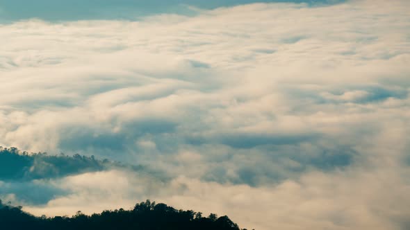 Clouds Moving Above Mountain