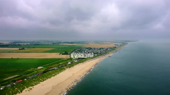 Aerial - empty beach from above, ascending drone shot, Norfolk, England