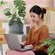 Happy young Asian woman enjoy to shopping from online shopping platform by laptop computer. - VideoHive Item for Sale