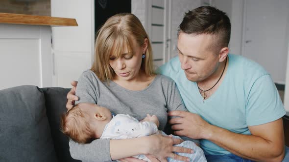 Young Family with a Child Two Months Father Mother and Son