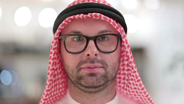 Close Up of Young Arab Businessman Looking at the Camera