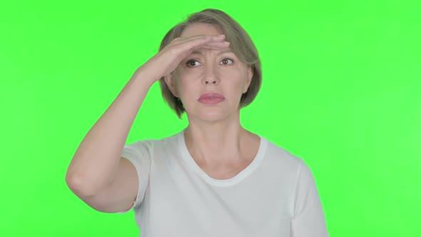 Old Woman Looking Around Searching Green Screen